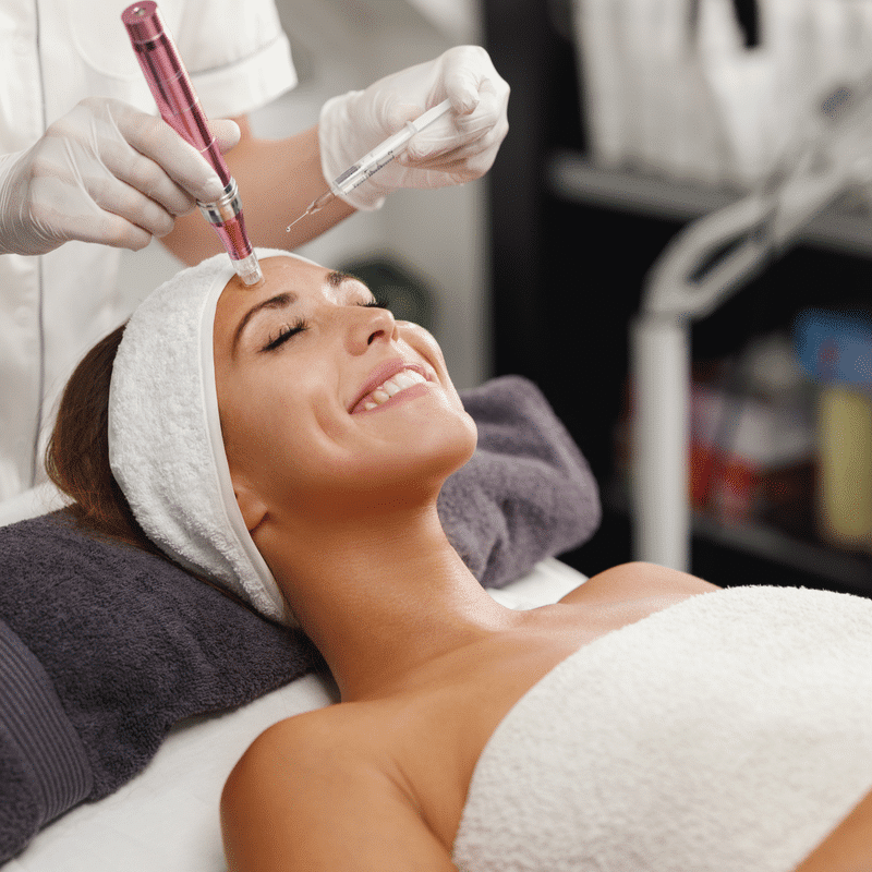 woman smiling getting microneedling