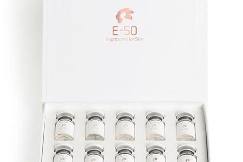 Healthium Web images (2) A white box labeled E-50 Reposome for Skin contains ten small glass vials with gray caps, arranged in two rows of five.