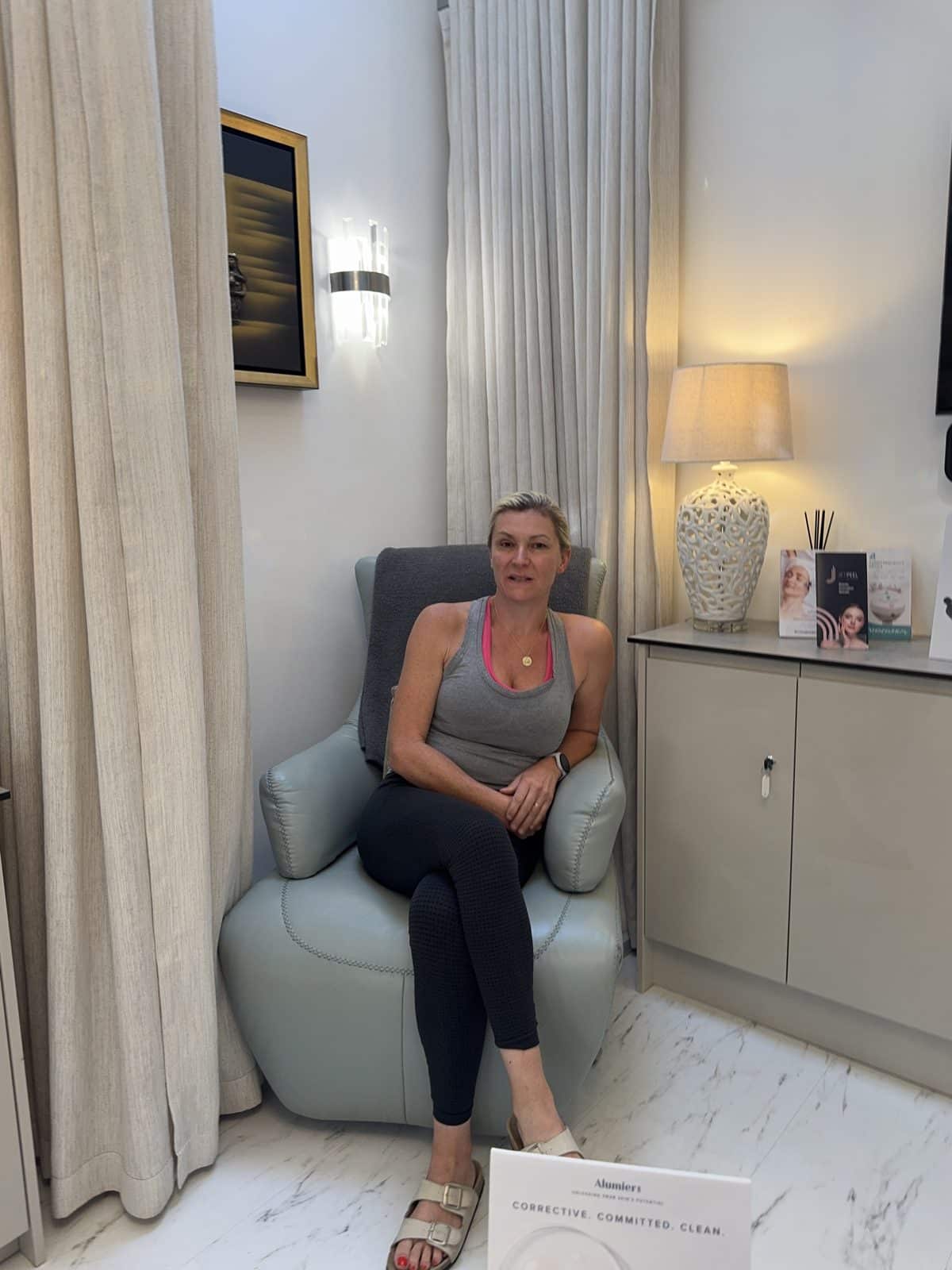 A client in the Healthium Clinics treatment room before an AlumierMD skin consultation